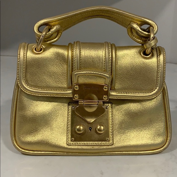 gold top handle bag
